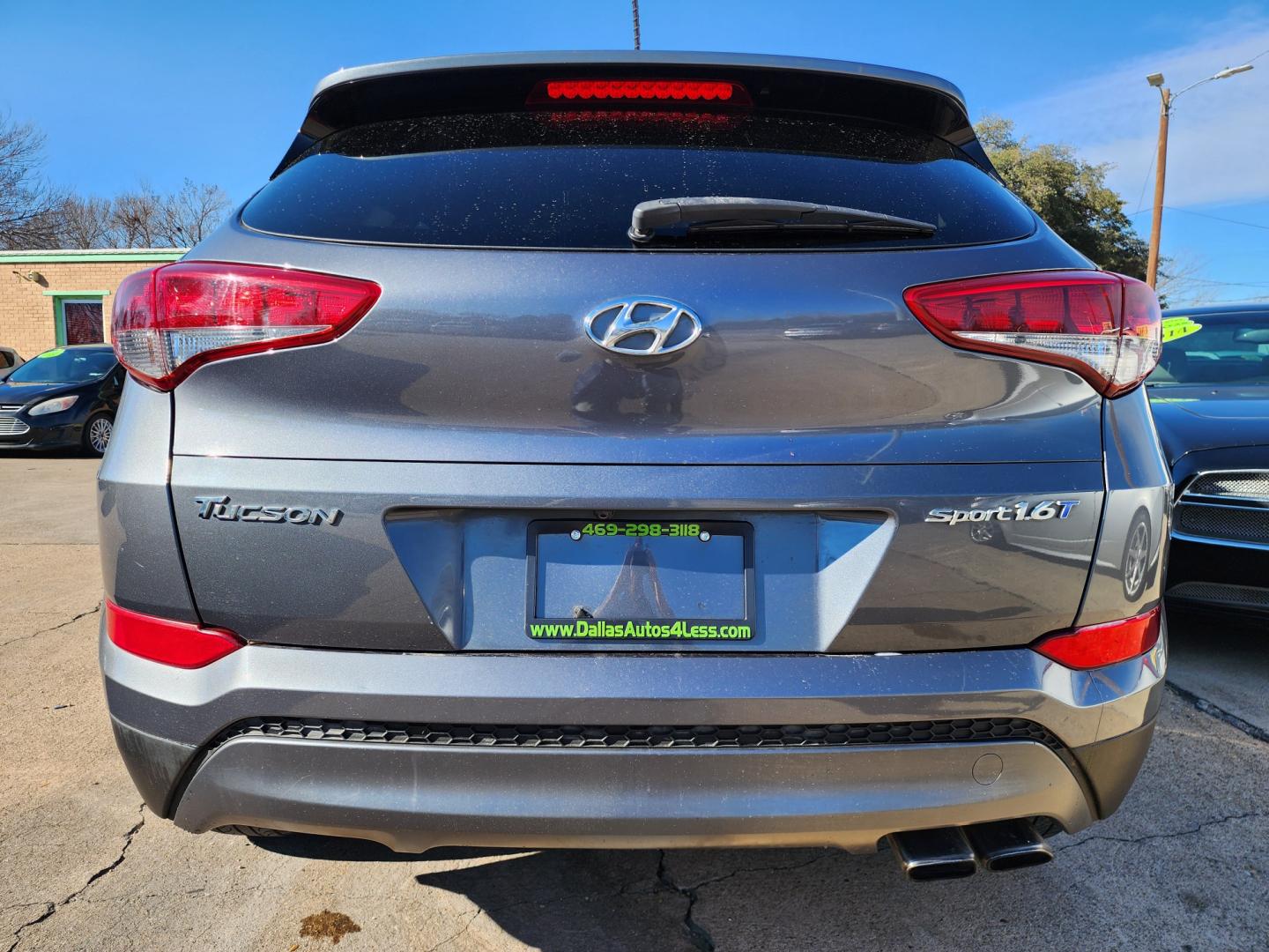 2016 BLACK Hyundai Tucson Sport (KM8J33A21GU) with an 1.6L L4 DOHC 16V engine, 7A transmission, located at 2660 S.Garland Avenue, Garland, TX, 75041, (469) 298-3118, 32.885551, -96.655602 - Welcome to DallasAutos4Less, one of the Premier BUY HERE PAY HERE Dealers in the North Dallas Area. We specialize in financing to people with NO CREDIT or BAD CREDIT. We need proof of income, proof of residence, and a ID. Come buy your new car from us today!! This is a Very clean 2016 HYUNDAI TUC - Photo#4